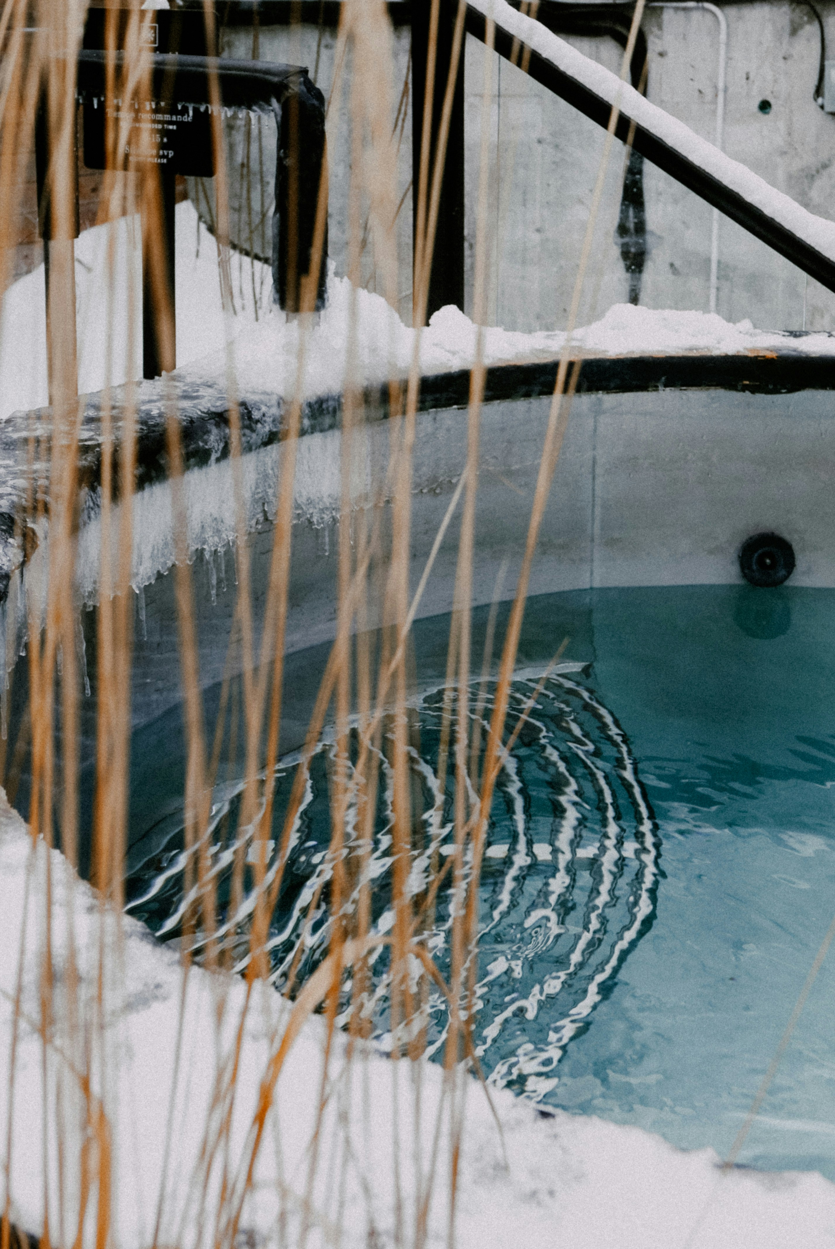 Steaming outdoor hot tub in deep mountain snow